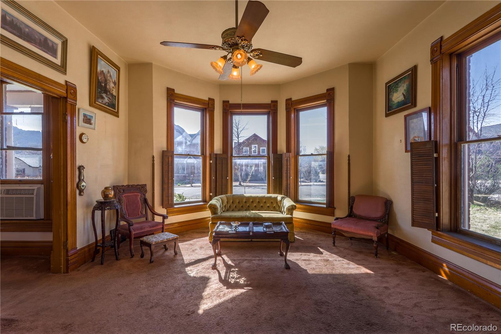 846 F Street Salida, CO 81201 - Photo 12 of 43 a living room with furniture and floor to ceiling windows
