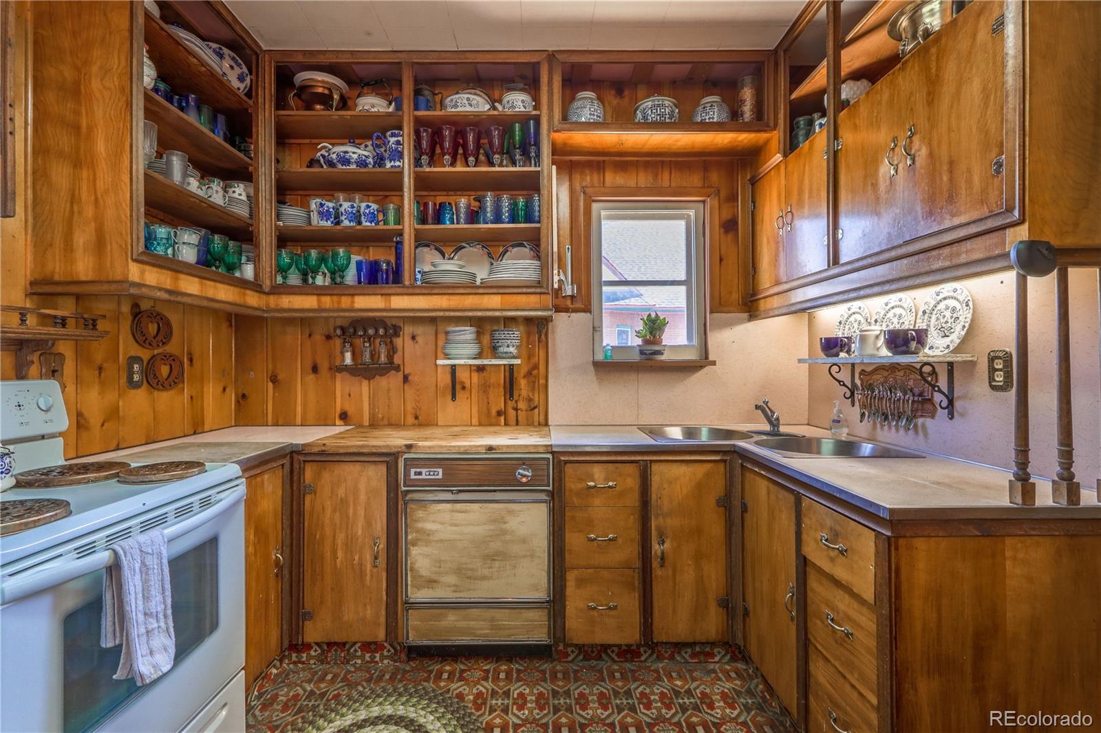 846 F Street Salida, CO 81201 - Photo 14 of 43 a kitchen with stainless steel appliances granite countertop a stove and cabinets