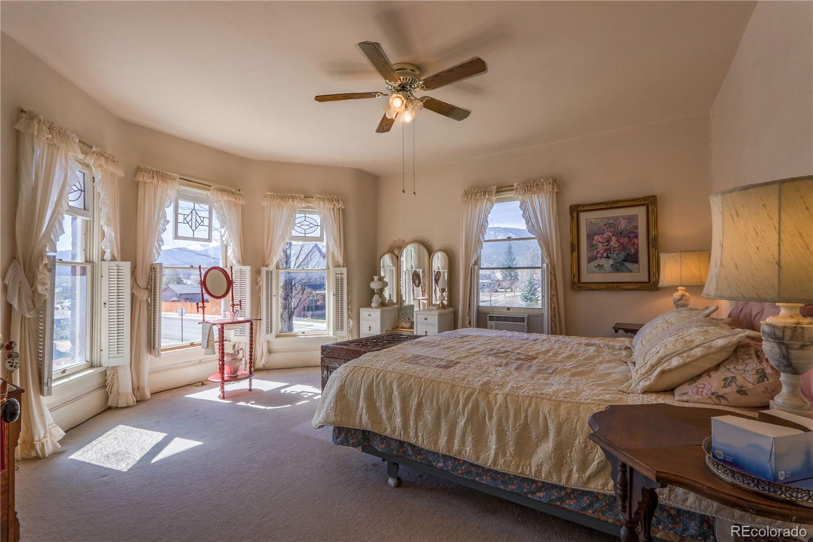 846 F Street Salida, CO 81201 - Photo 28 of 43 a bedroom with a large bed and a chandelier