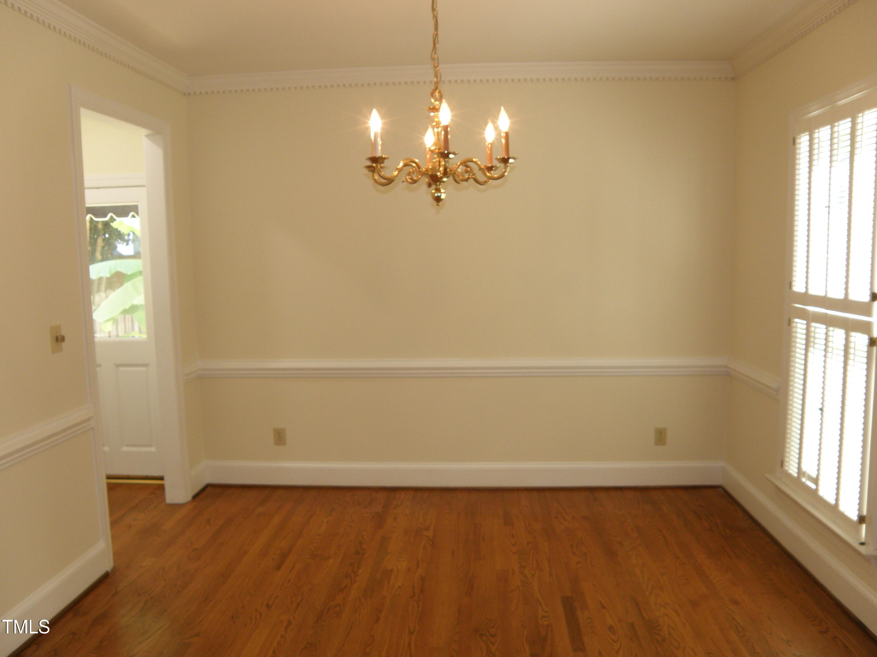 2532 Ashley Court Raleigh, NC 27607 - Photo 13 of 39 wooden floor in an empty room with a window