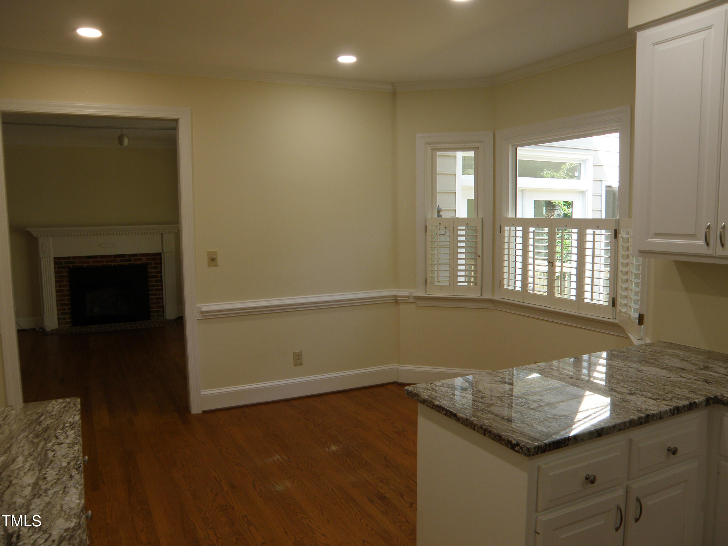 2532 Ashley Court Raleigh, NC 27607 - Photo 18 of 39 a kitchen with a sink cabinets and a wooden floor