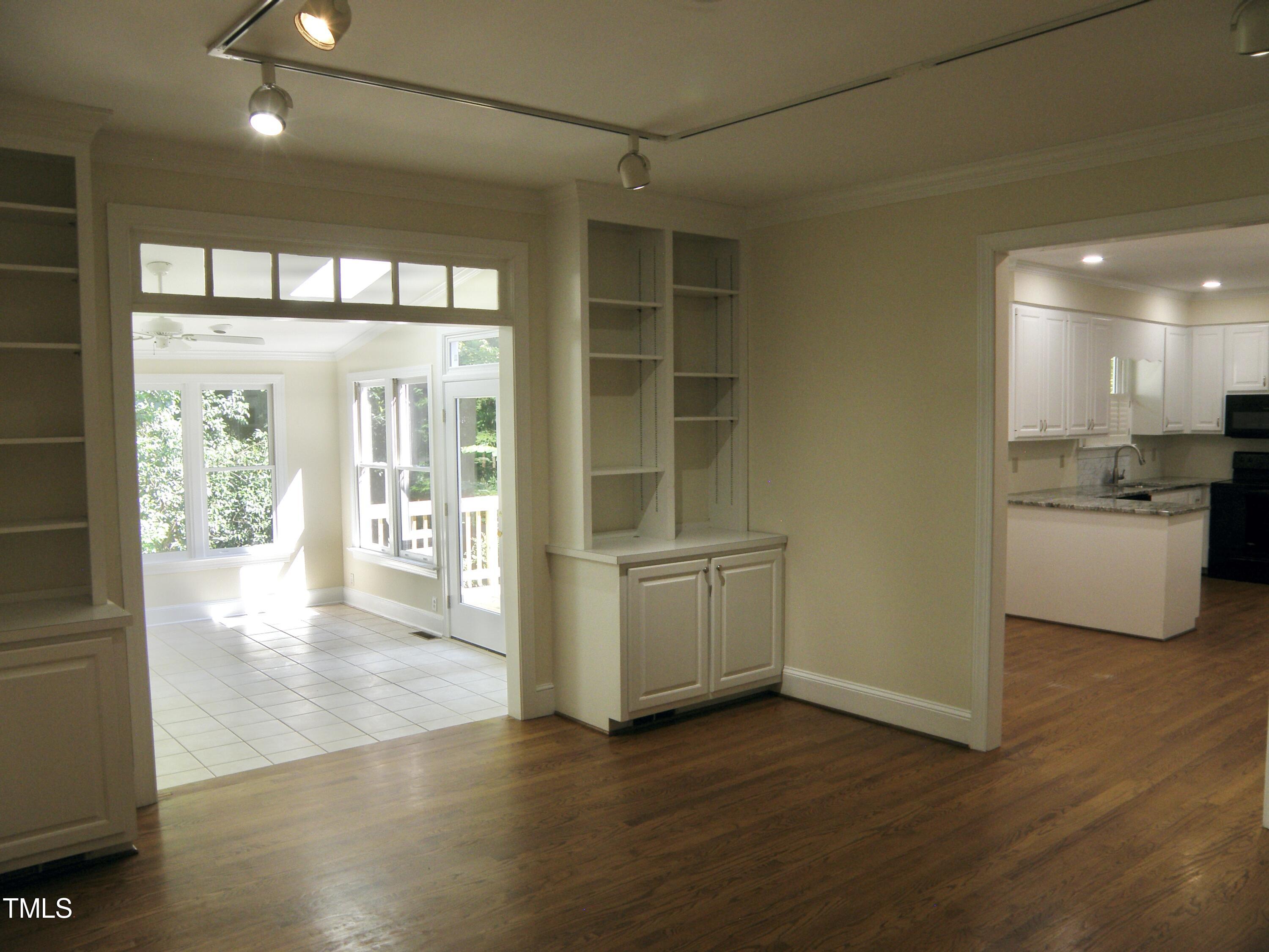 2532 Ashley Court Raleigh, NC 27607 - Photo 24 of 39 a kitchen with a refrigerator and wooden floor