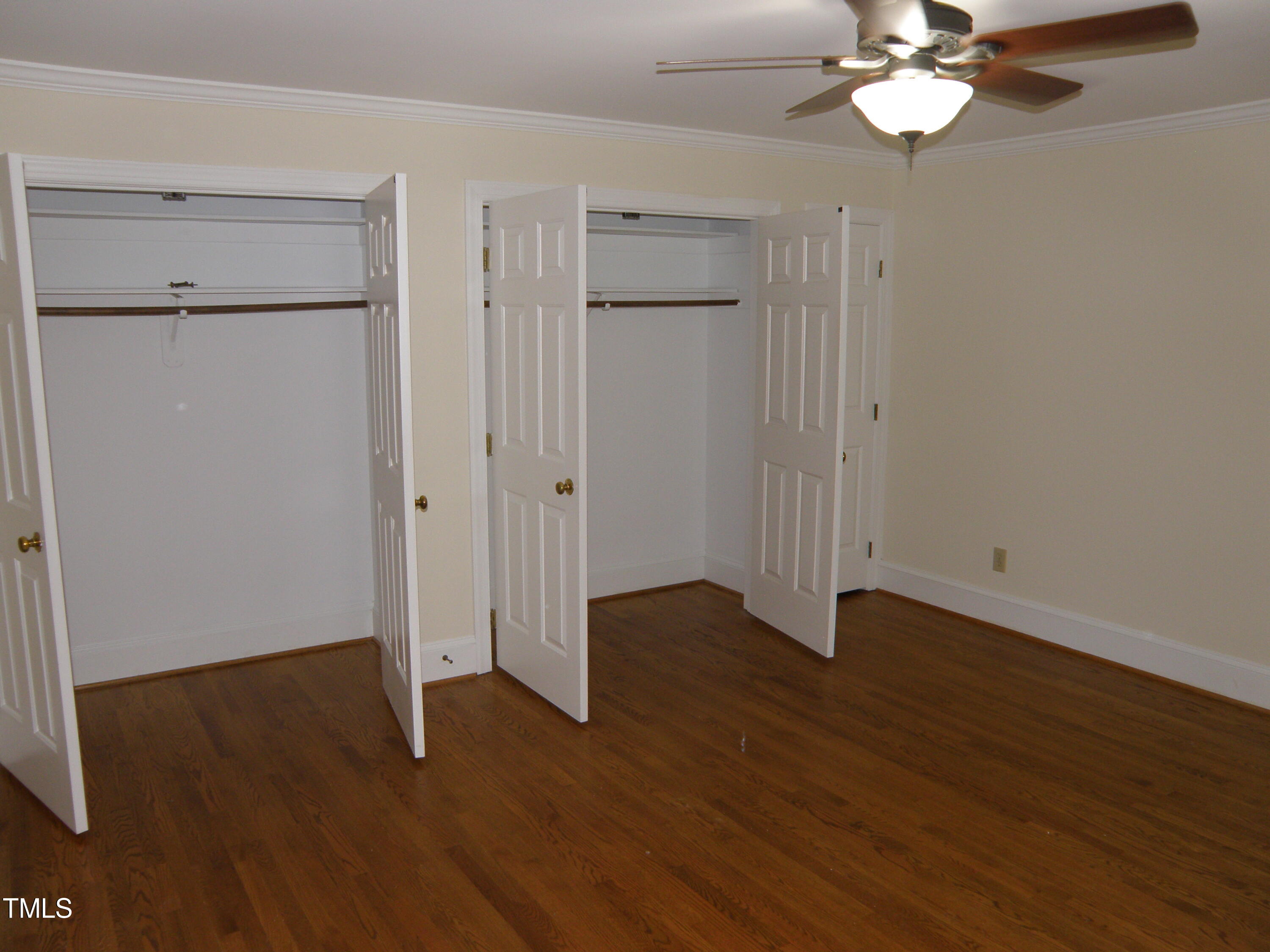 2532 Ashley Court Raleigh, NC 27607 - Photo 29 of 39 an empty room with wooden floor closet and windows