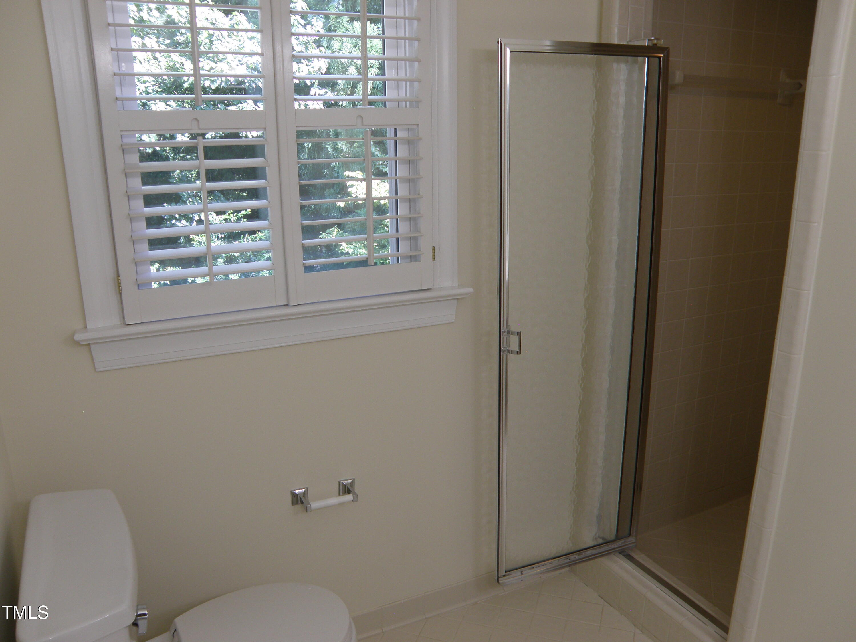 2532 Ashley Court Raleigh, NC 27607 - Photo 30 of 39 a white toilet sitting next to a window