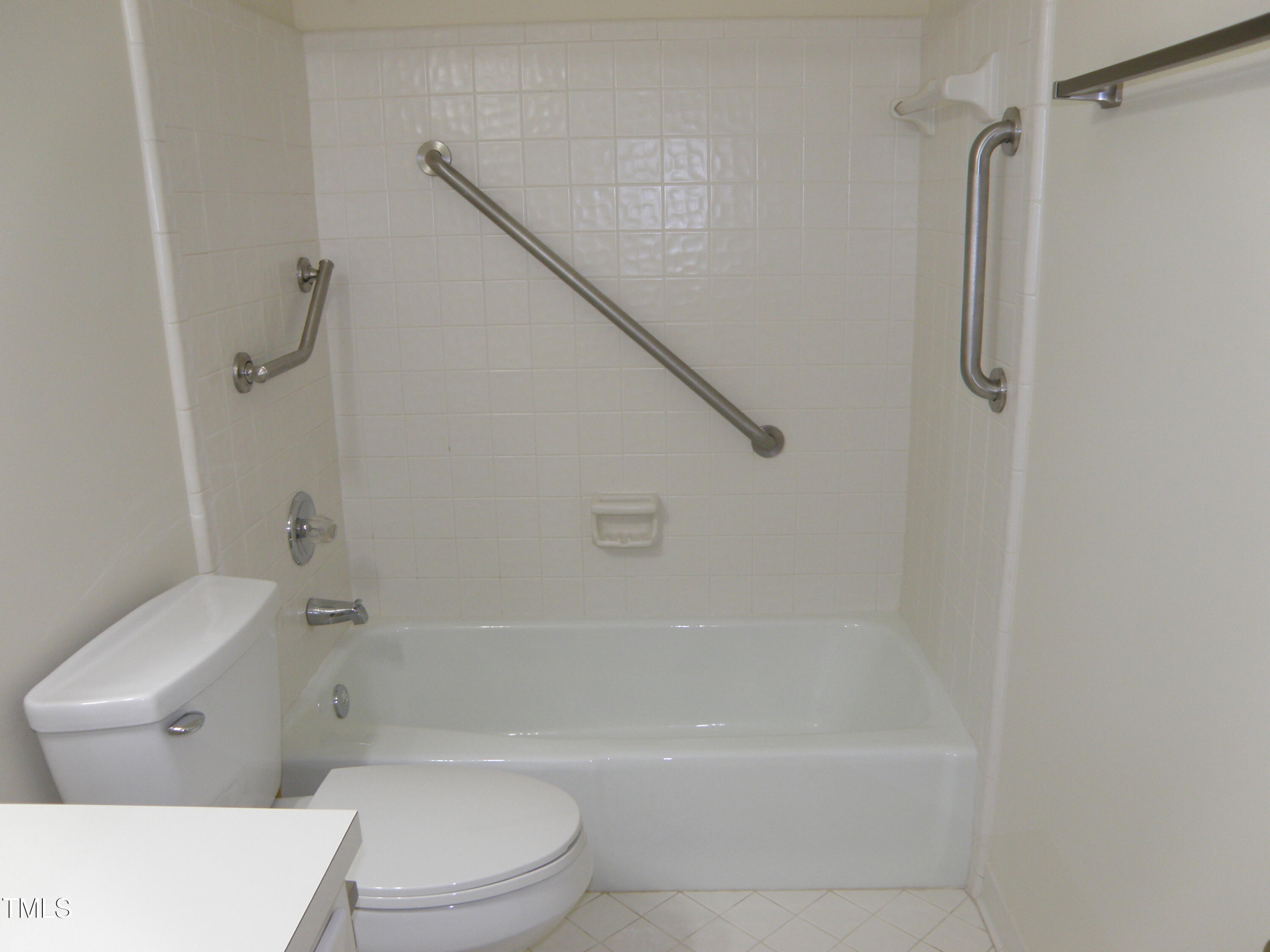 2532 Ashley Court Raleigh, NC 27607 - Photo 34 of 39 a bathroom with a shower and a toilet