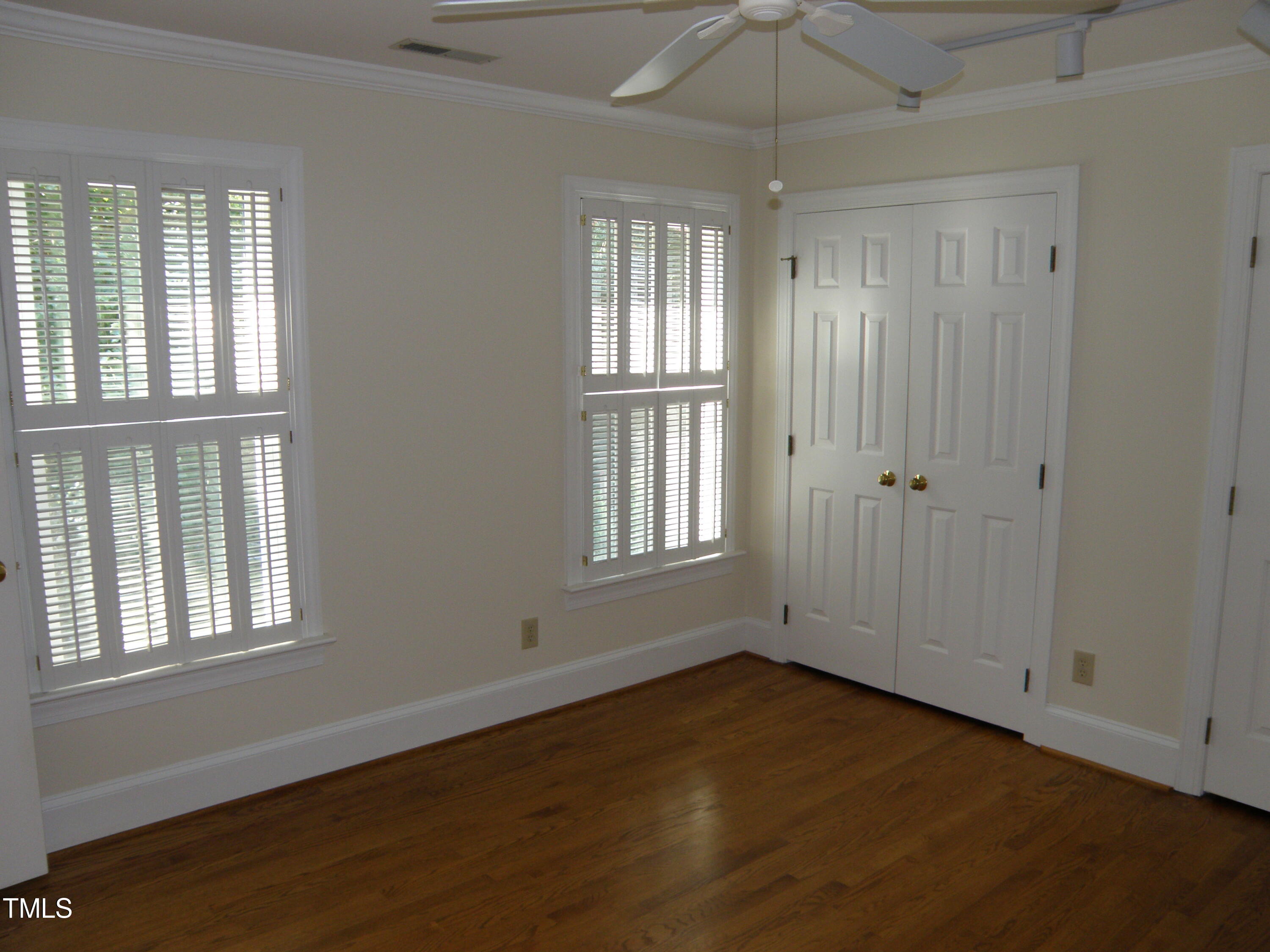 2532 Ashley Court Raleigh, NC 27607 - Photo 36 of 39 an empty room with wooden floor and windows