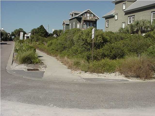 1 Winston Ln Inlet Beach Inlet Beach, FL 32461 - Photo 2 of 4 a front view of a house with a yard and garage