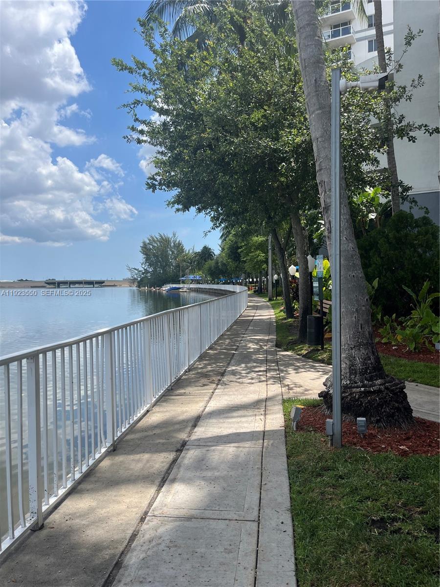 5099 Northwest 7th Street, Unit 1005 Miami, FL 33126 - Photo 14 of 35 a view of backyard with green space