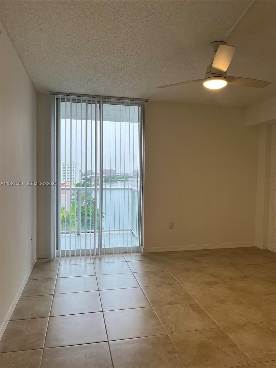 5099 Northwest 7th Street, Unit 1005 Miami, FL 33126 - Photo 18 of 35 a view of an empty room and window