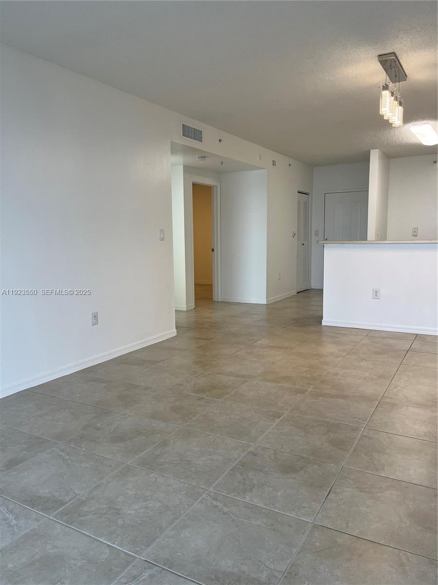 5099 Northwest 7th Street, Unit 1005 Miami, FL 33126 - Photo 20 of 35 a view of an empty room