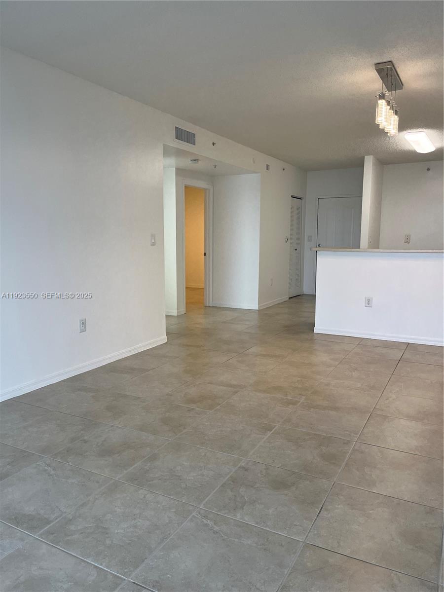 5099 Northwest 7th Street, Unit 1005 Miami, FL 33126 - Photo 23 of 35 a view of an empty room