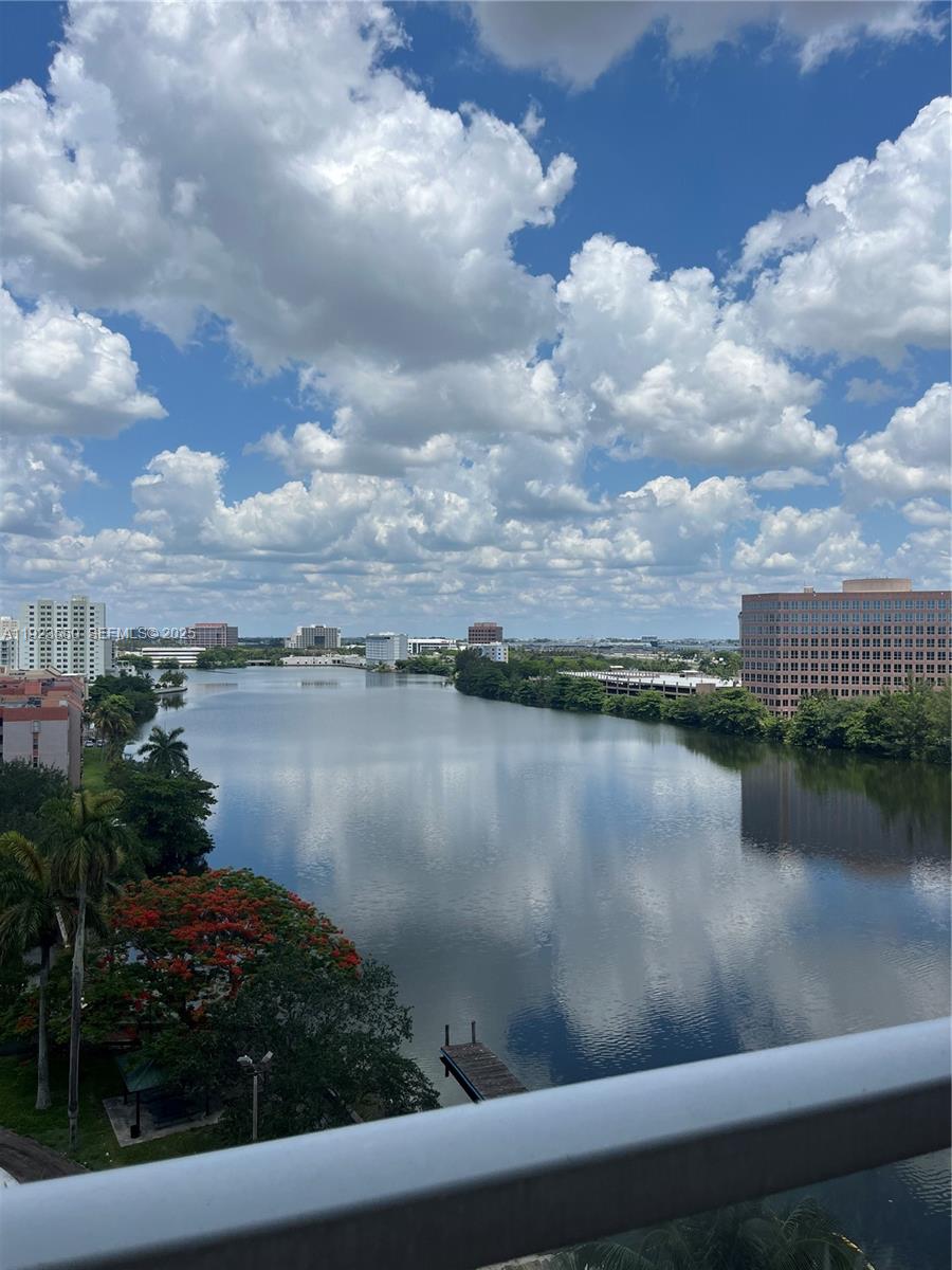 5099 Northwest 7th Street, Unit 1005 Miami, FL 33126 - Photo 32 of 35 a view of a lake from a balcony