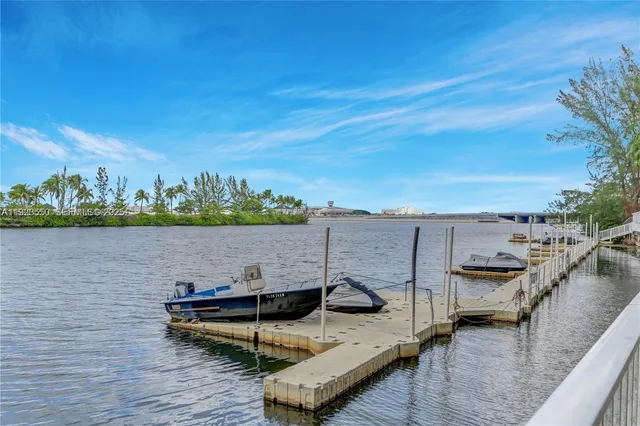 a view of a lake with couches chairs