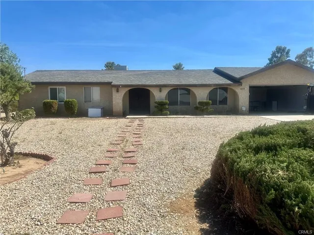 a front view of a house with yard