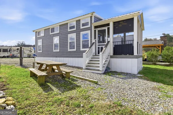 front view of a house with a yard