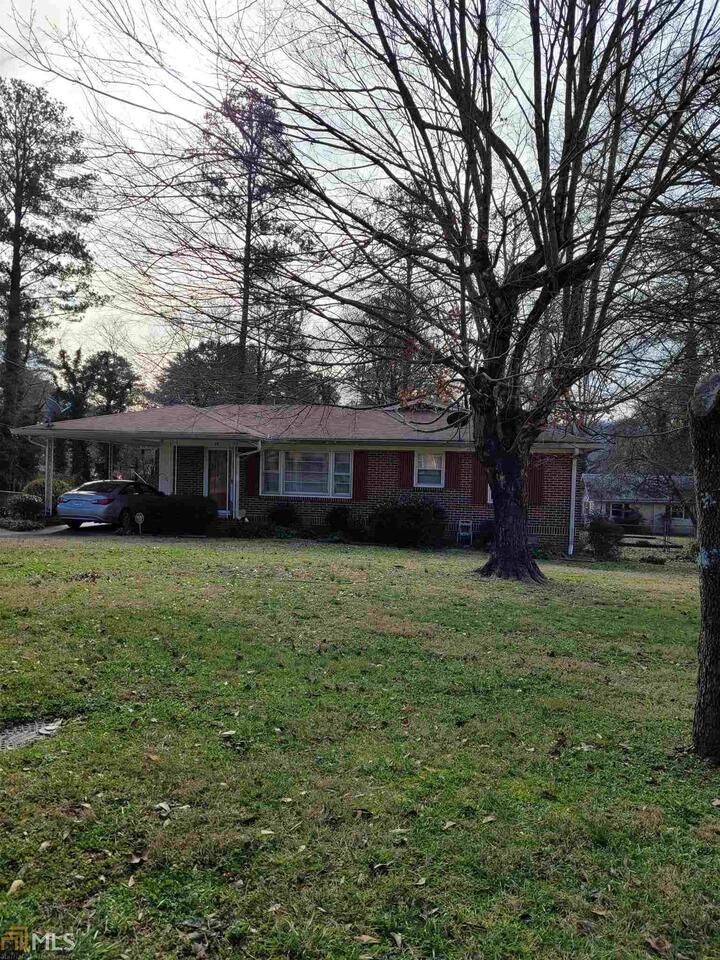 29 Meadow Lane Southwest Rome, GA 30165 - Photo 1 of 1 a front view of a house with a garden