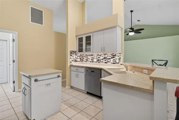 a bathroom with a sink vanity and toilet