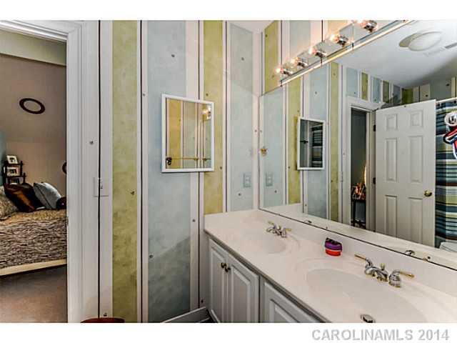 500 South Sharon Amity Road Charlotte, NC 28211 - Photo 13 of 16 a bathroom with a sink double vanity and a shower