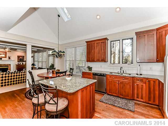 500 South Sharon Amity Road Charlotte, NC 28211 - Photo 4 of 16 a kitchen with granite countertop a sink cabinets and window