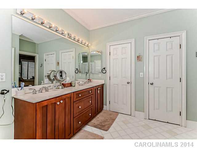 500 South Sharon Amity Road Charlotte, NC 28211 - Photo 9 of 16 a bathroom with a sink mirror and a shower