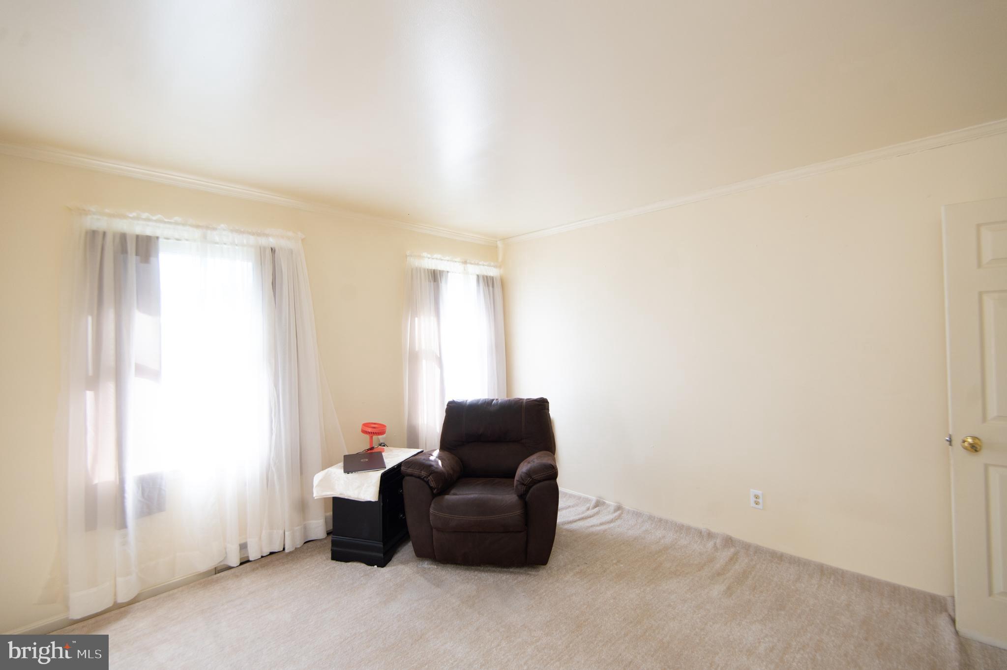 807 Bayly Road Cambridge, MD 21613 - Photo 21 of 36 a living room with furniture and a window