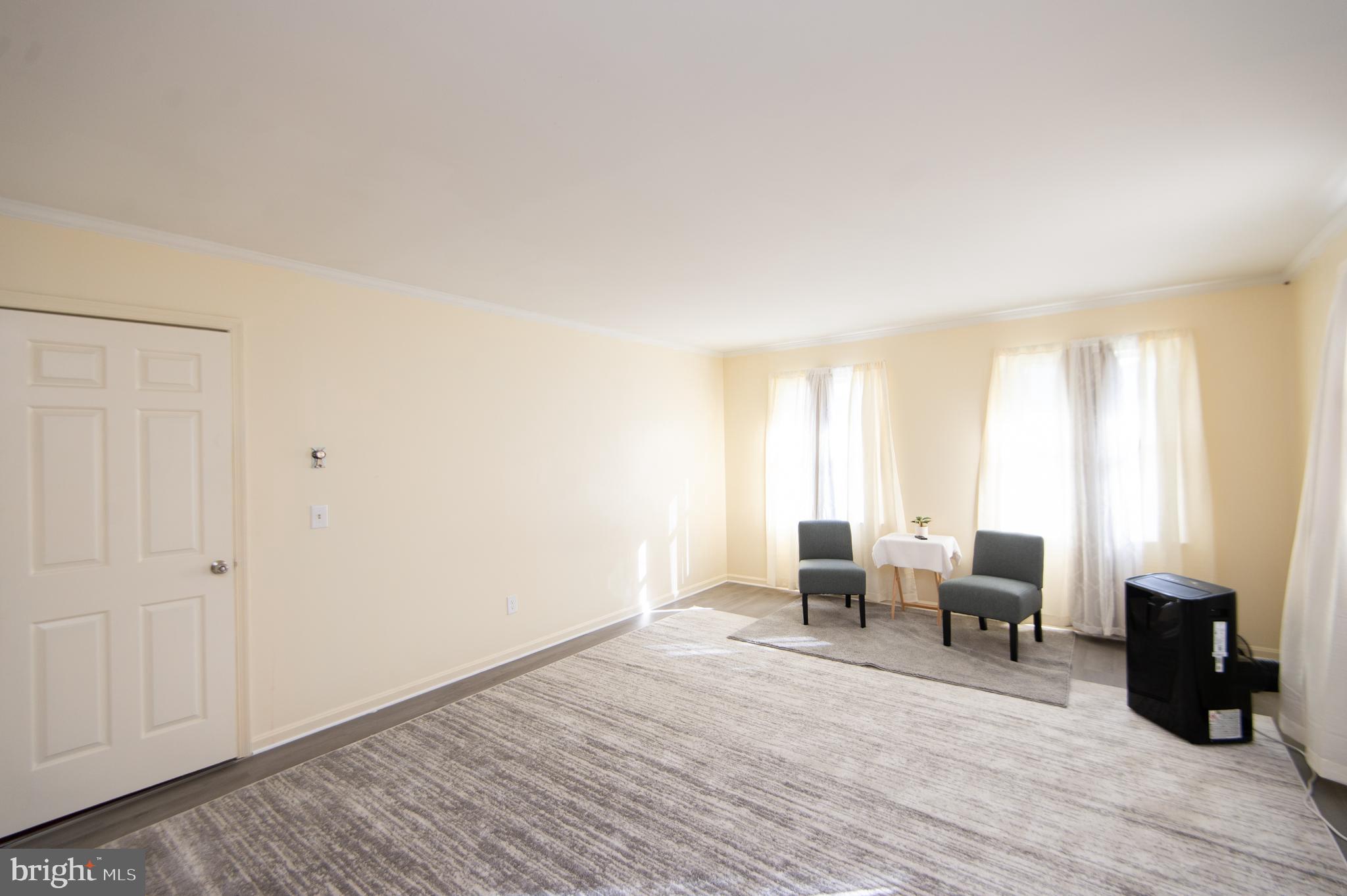 807 Bayly Road Cambridge, MD 21613 - Photo 24 of 36 a living room with furniture and wooden floor