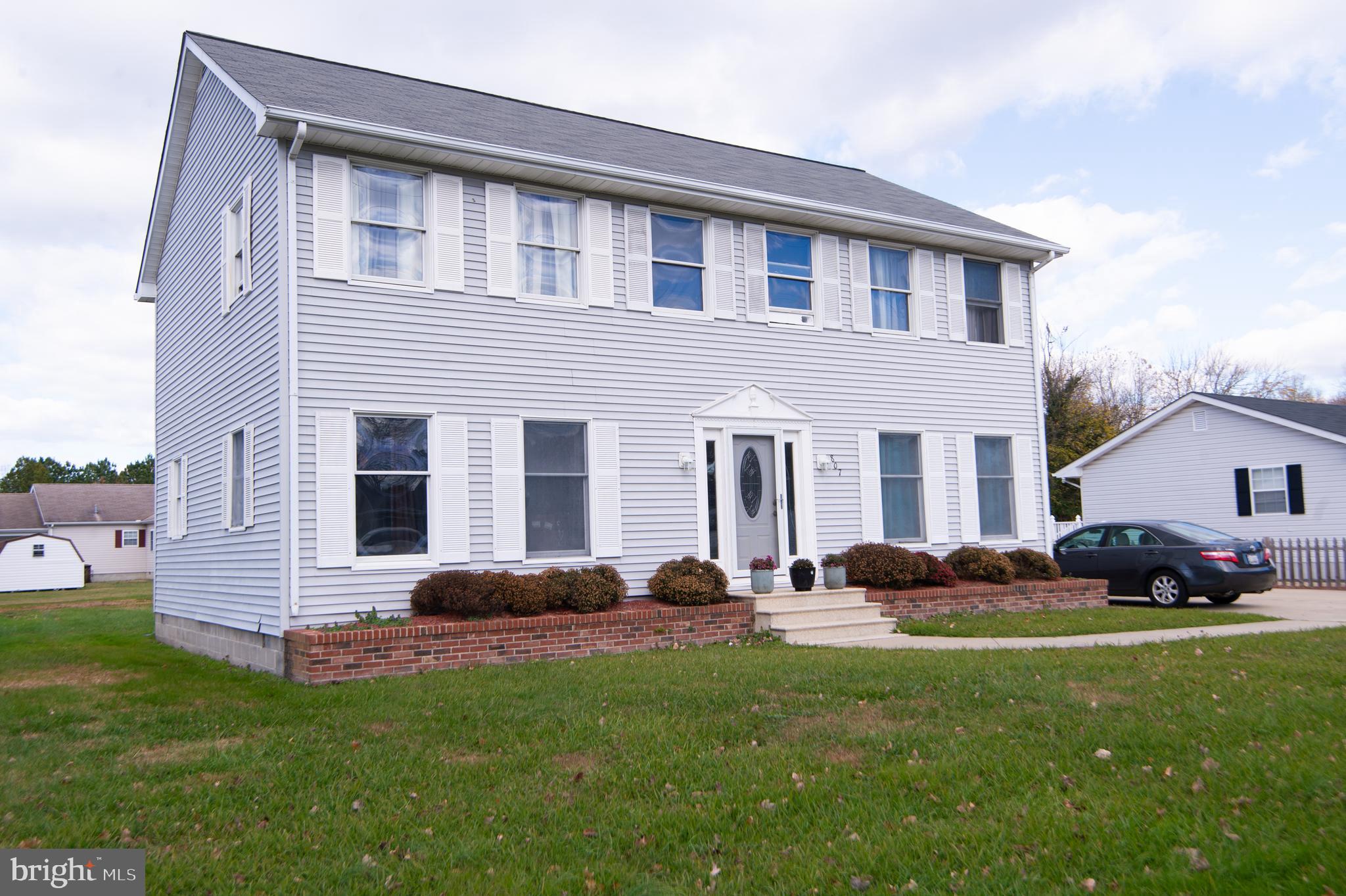 807 Bayly Road Cambridge, MD 21613 - Photo 34 of 36 a backyard of a house with table and chairs