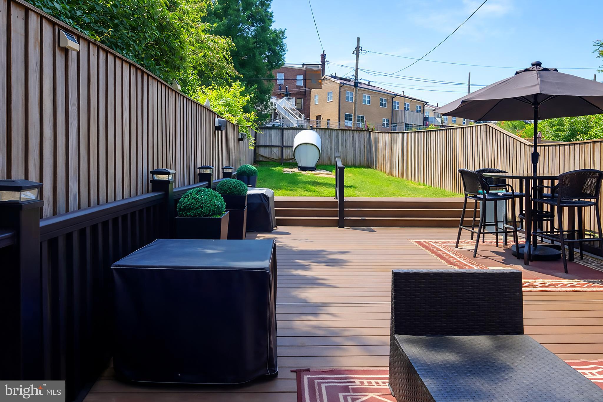 3935 Clay Place Northeast Washington, DC 20019 - Photo 17 of 17 a view of a patio with a table chairs and barbeque