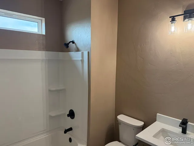 a bathroom with a toilet and a sink