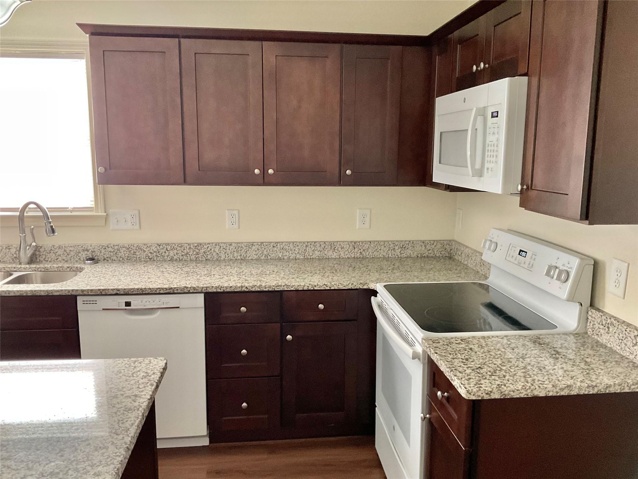 1285 Janice Road Lincolnton, NC 28092 - Photo 6 of 19 a kitchen with a sink a stove and cabinets