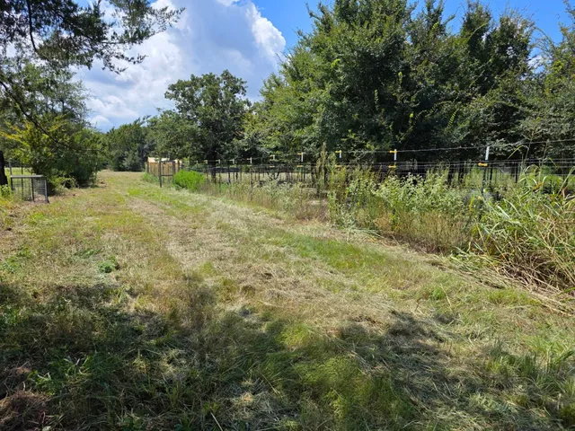 a view of lake with a yard