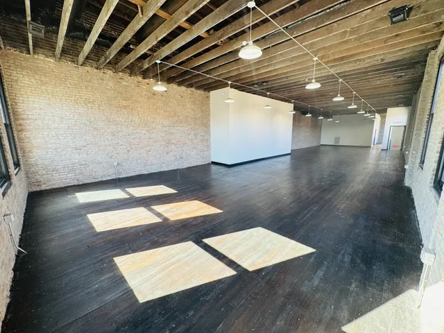 a view of room with wooden floor
