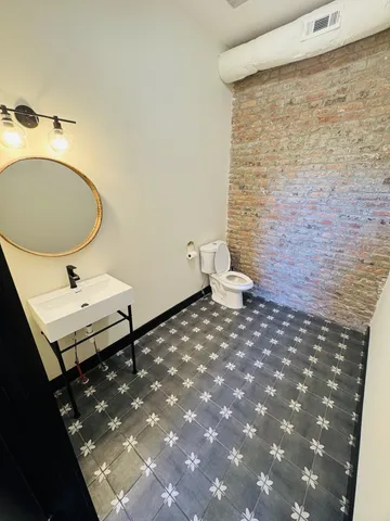 a bathroom with a sink and a toilet