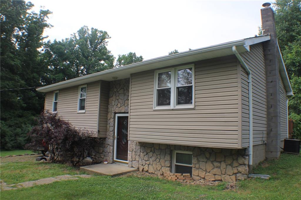 1639 Deckers Point Road Marion Center, PA 15759 - Photo 2 of 26 a front view of a house with garden