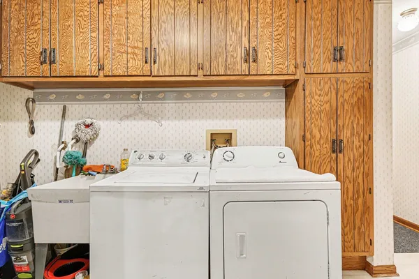 a utility room with dryer and washer