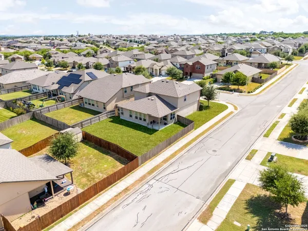 an aerial view of residential building and parking space