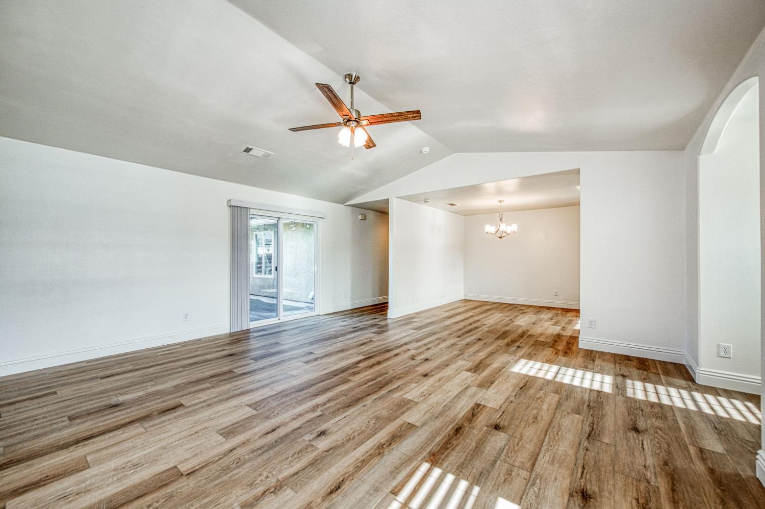 5176 West Michigan Avenue Fresno, CA 93722 - Photo 25 of 37 a view of empty room with wooden floor and fan