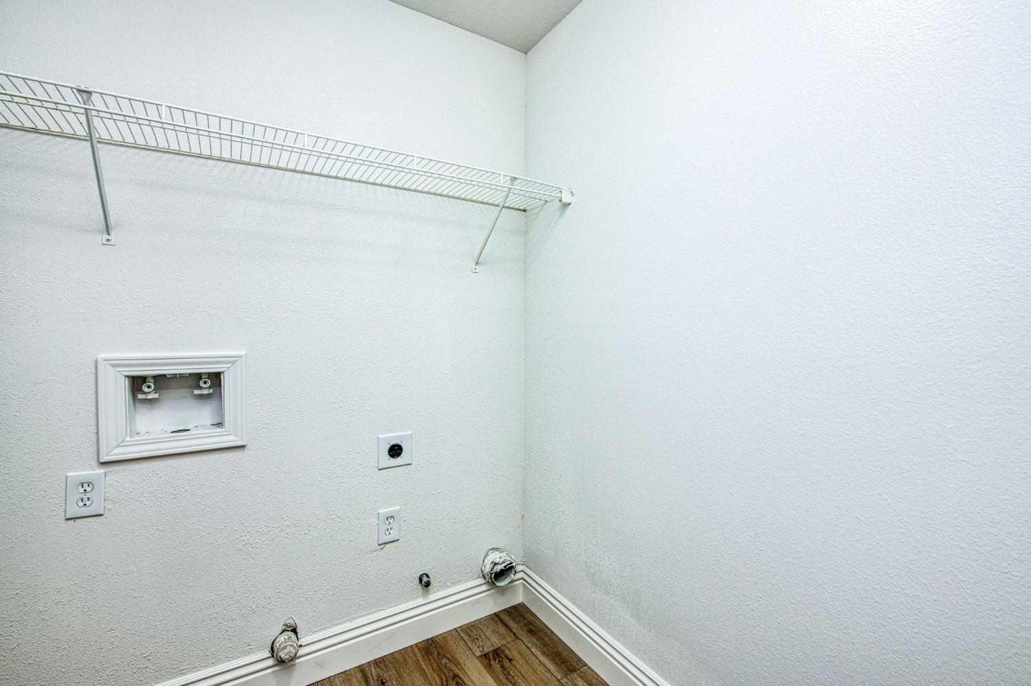 5176 West Michigan Avenue Fresno, CA 93722 - Photo 33 of 37 a view of a room with racks on the wall