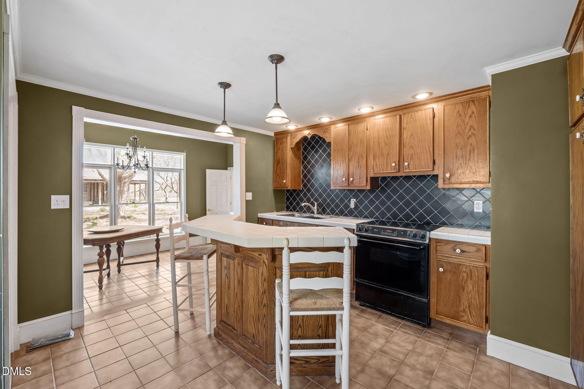 212 Thomas Humphries Road Roxboro, NC 27574 - Photo 35 of 56 a kitchen with a stove a sink and a refrigerator