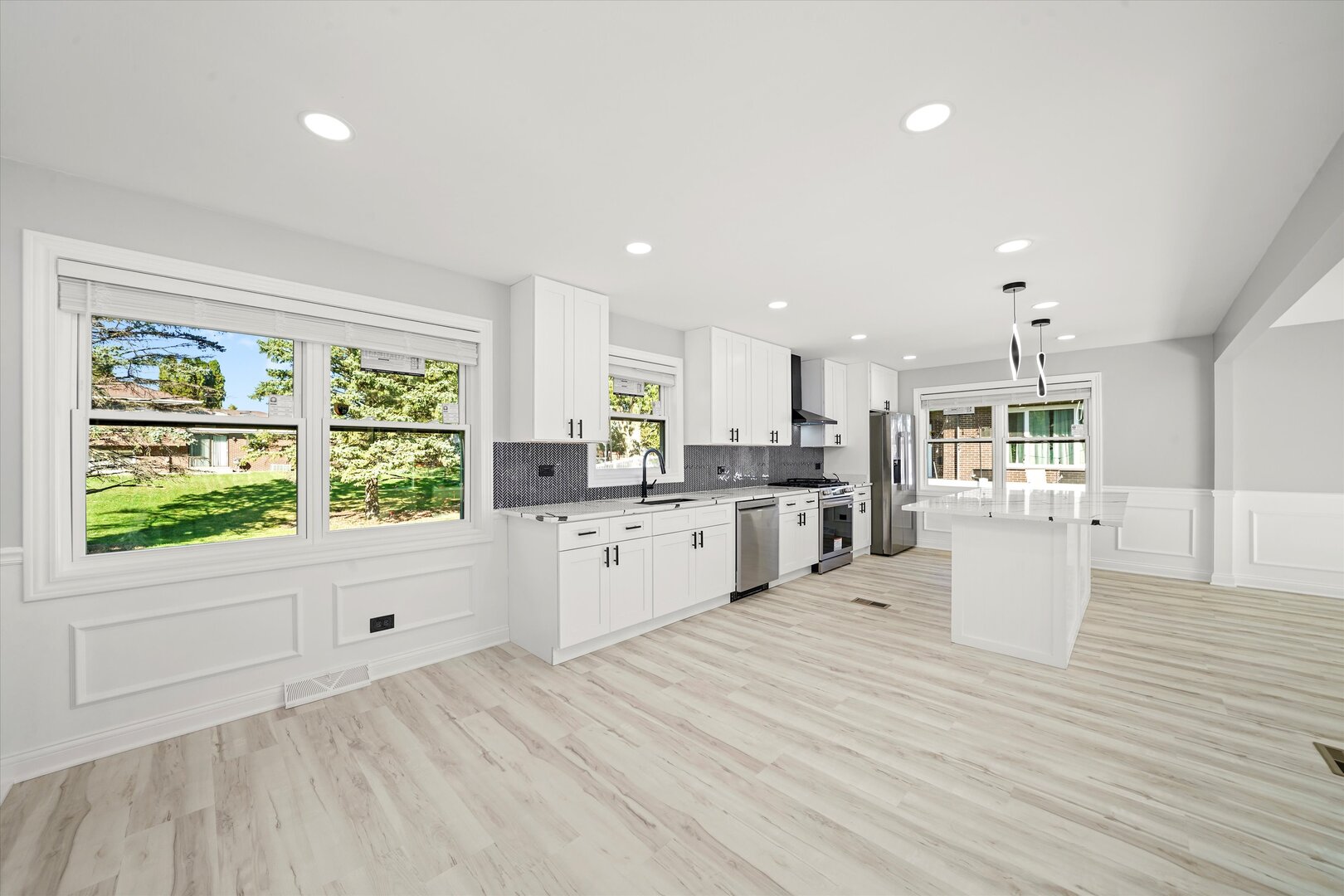 513 Chestnut Lane Beecher, IL 60401 - Photo 12 of 38 a large white kitchen with a large window