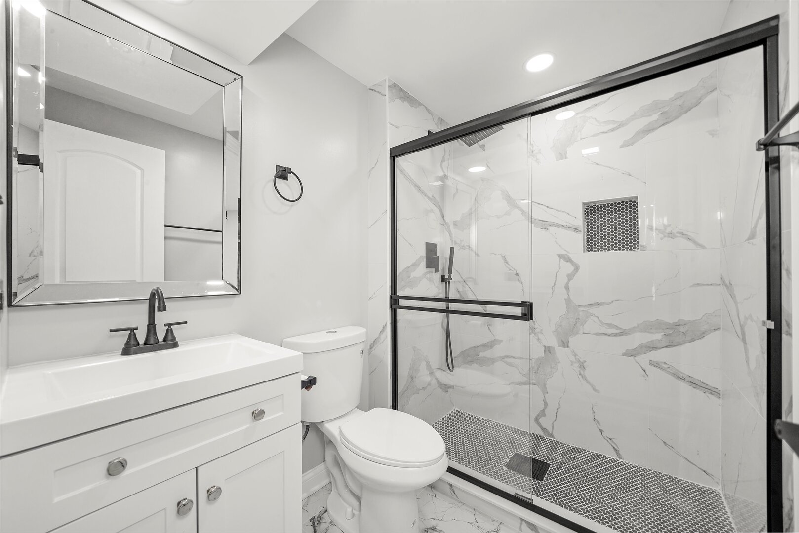 513 Chestnut Lane Beecher, IL 60401 - Photo 19 of 38 a bathroom with a shower sink vanity mirror and toilet