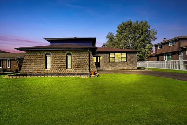 a house view with swimming pool in front of it