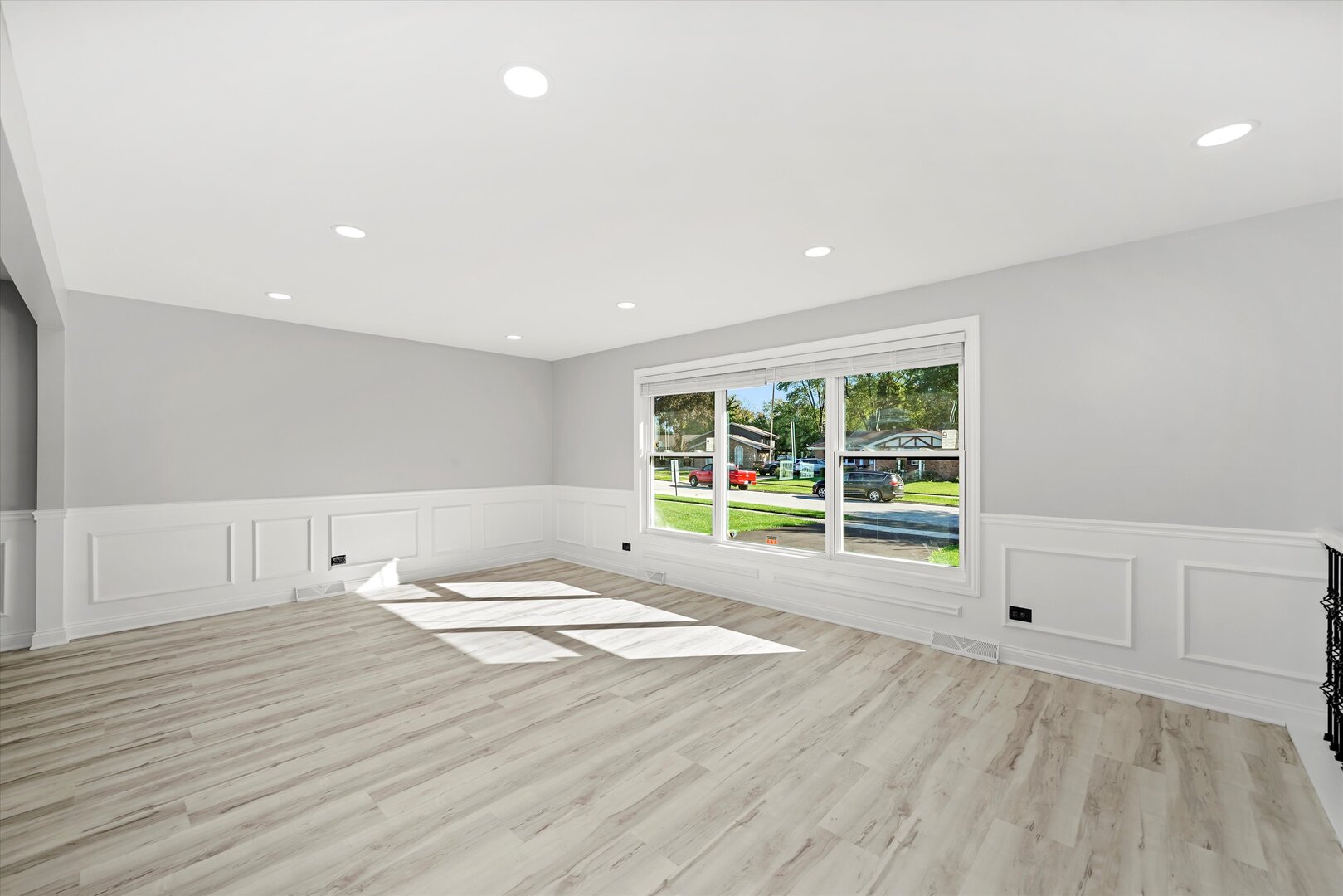 513 Chestnut Lane Beecher, IL 60401 - Photo 5 of 38 a view of an empty room with a window and wooden floor