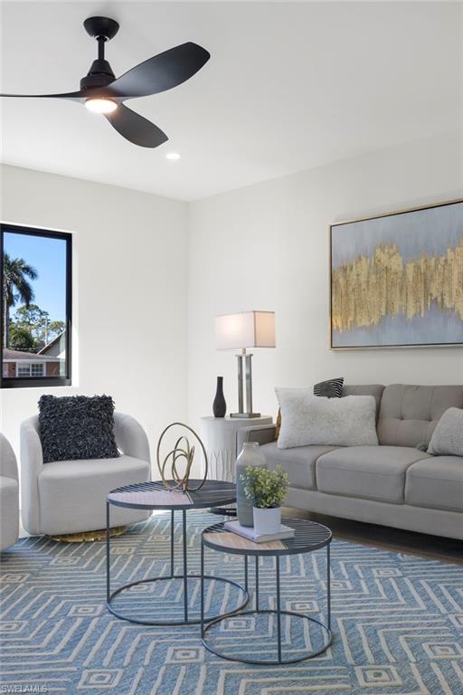 3613 Poplar Way Naples, FL 34112 - Photo 25 of 43 a living room with furniture and a potted plant