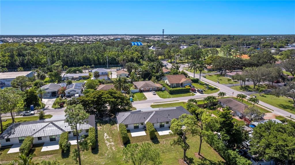 3613 Poplar Way Naples, FL 34112 - Photo 37 of 43 a view of a city with lots of residential buildings ocean and mountain view in back