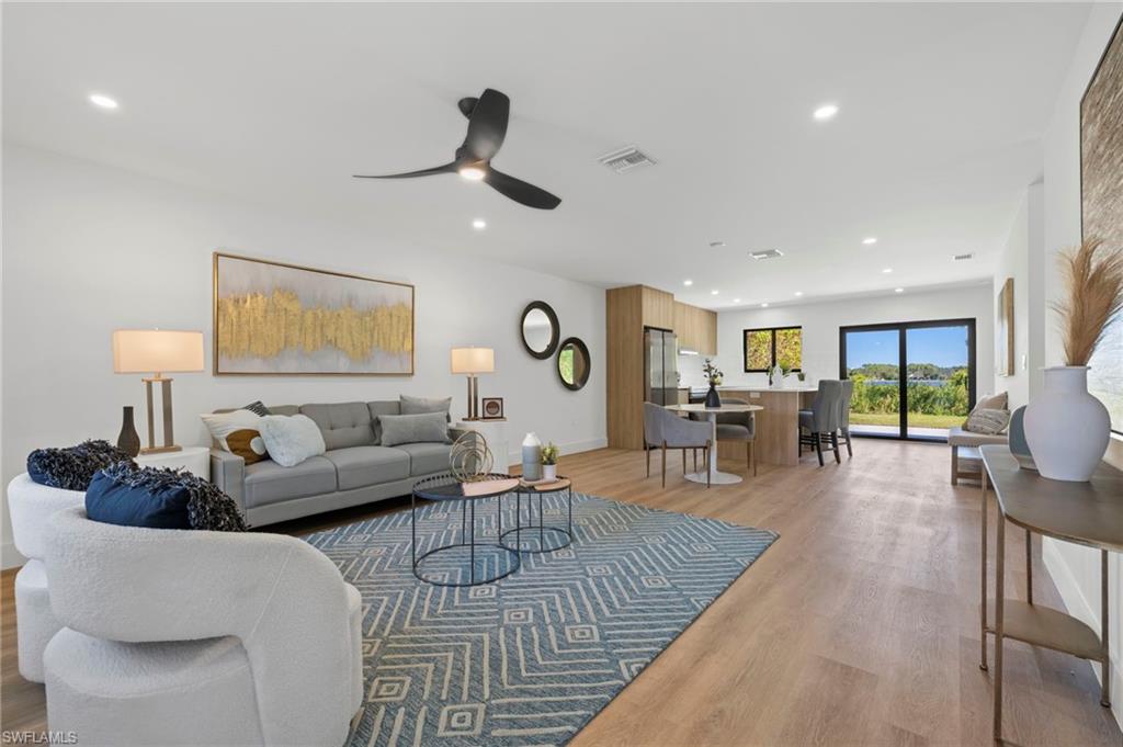3613 Poplar Way Naples, FL 34112 - Photo 6 of 43 a living room with furniture and wooden floor