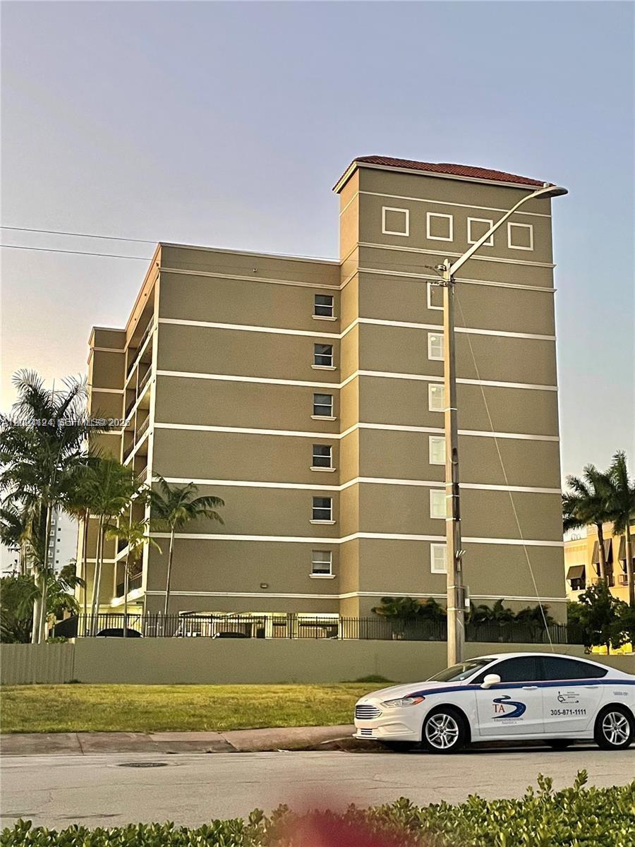 120 South Douglas Road, Unit 302 Miami, FL 33134 - Photo 27 of 28 a view of a car parked in front of a house