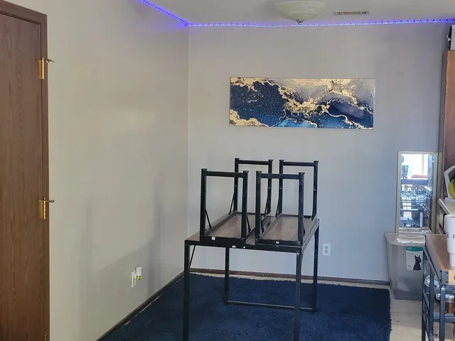 a view of a livingroom with furniture