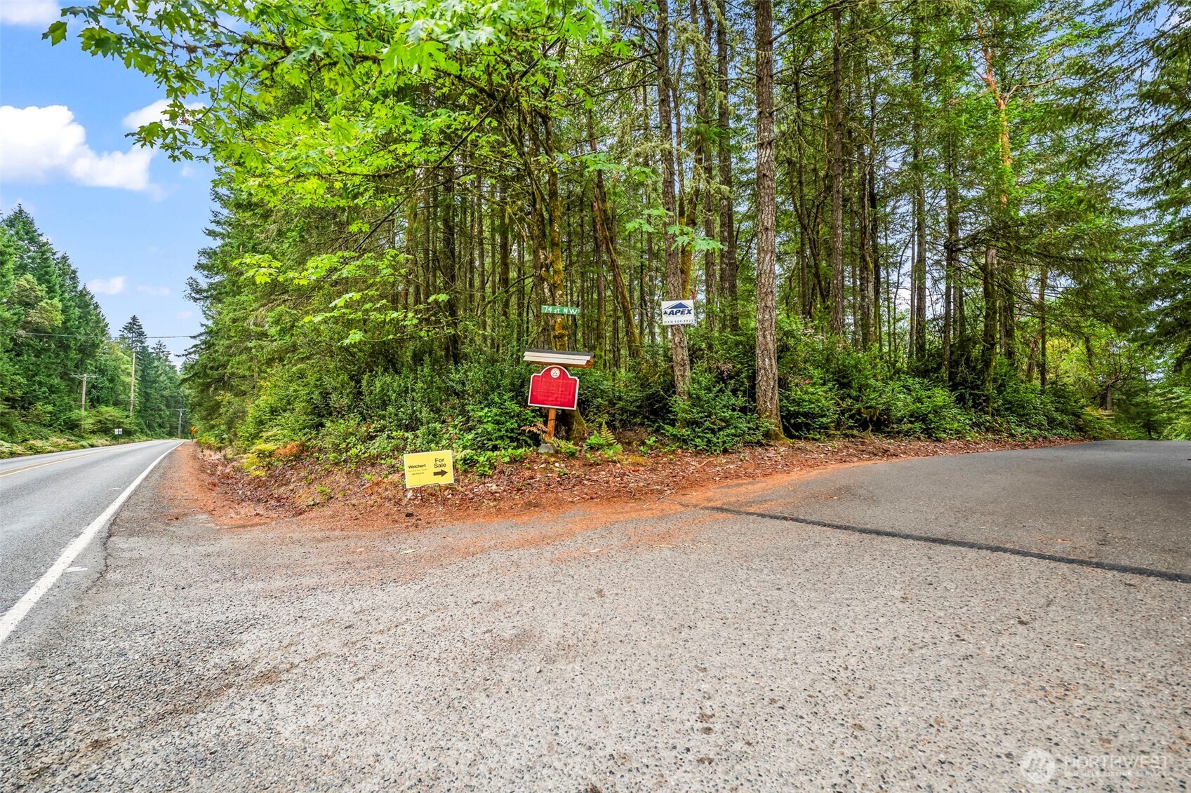17420 74th Street Northwest Vaughn, WA 98394 - Photo 15 of 17 a view of a roadside with trees
