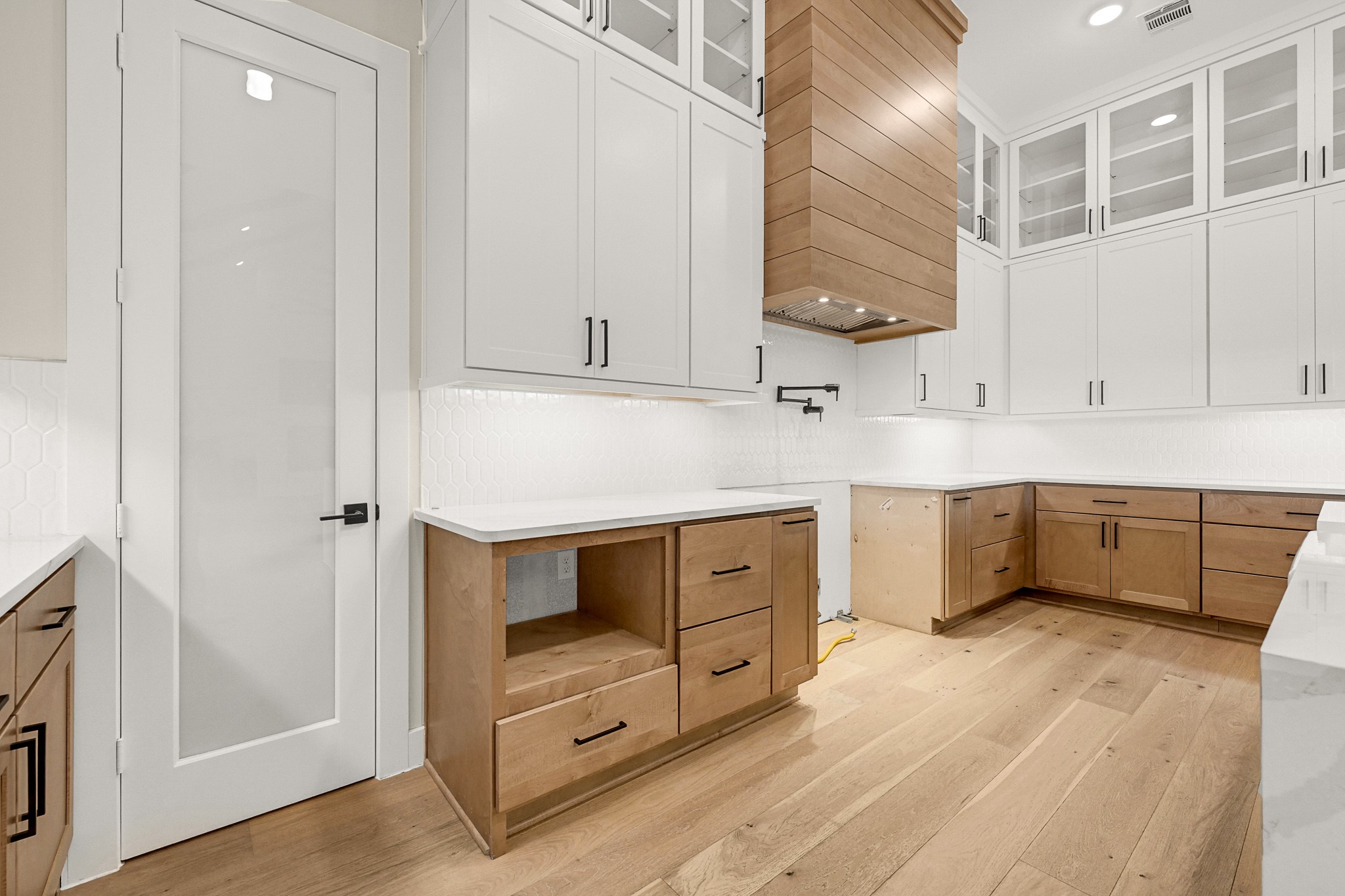 21230 Adriatic Run Drive Cypress, TX 77433 - Photo 10 of 50 a kitchen with stainless steel appliances a sink stove and cabinets